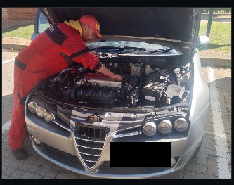Autopros technician working on a vehicle